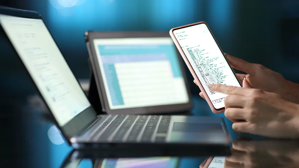Person using multiple devices.