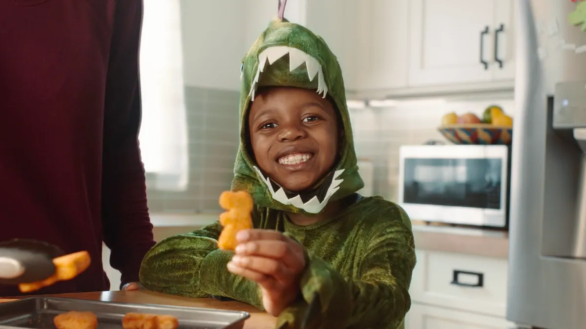 "Corn Kid" Tariq wears a costume in a Green Giant ad